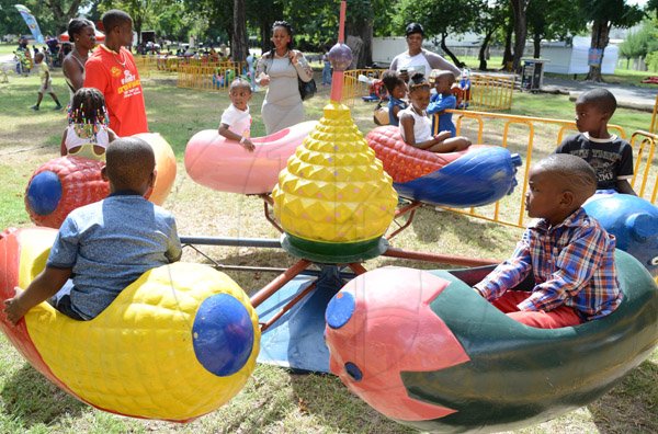 Ian Allen/Photographer
Children enjoy themselves in rides at the Lasco Family Extravaganza which was held at Hope Gardens on Boxing Day 2015.