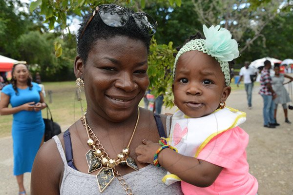 Ian Allen/Photographer
Ann Marie Dougllas left pose for the camera with  her daughter Tarjai Green while attending the Lasco Family Extravaganza in Hope Gardens on Boxing Day 2015.