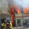 Norman Grindley/Chief Photographer
A major fire yesterday destroyed several houses on Regent Street in downtown Kingston. Three fire units and a water truck from the Jamaica Fire Brigade arrived on the scene as fire personnel attempted to contain the blaze.