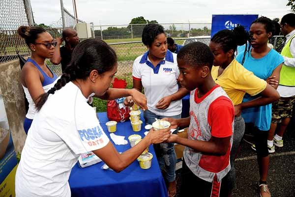 Lionel Rookwood/PhotographerThe Gleaner's Fit 4 Life event with the Trainfit Club's Outdoor Madness, Boxing Fitness with Sakima Mullings and Self Defense with Master Arthur Barrows on Saturday, November 11, at In Motion Gym, Shortwood Teachers' College, St Andrew. *** Local Caption *** Lionel Rookwood/PhotographerEnjoying hot, delicious bowls of sponsor Foska Oats’ new line of instance porridge, available in various flavours, as well as packets of Blue Diamond Almond, another sponsor.