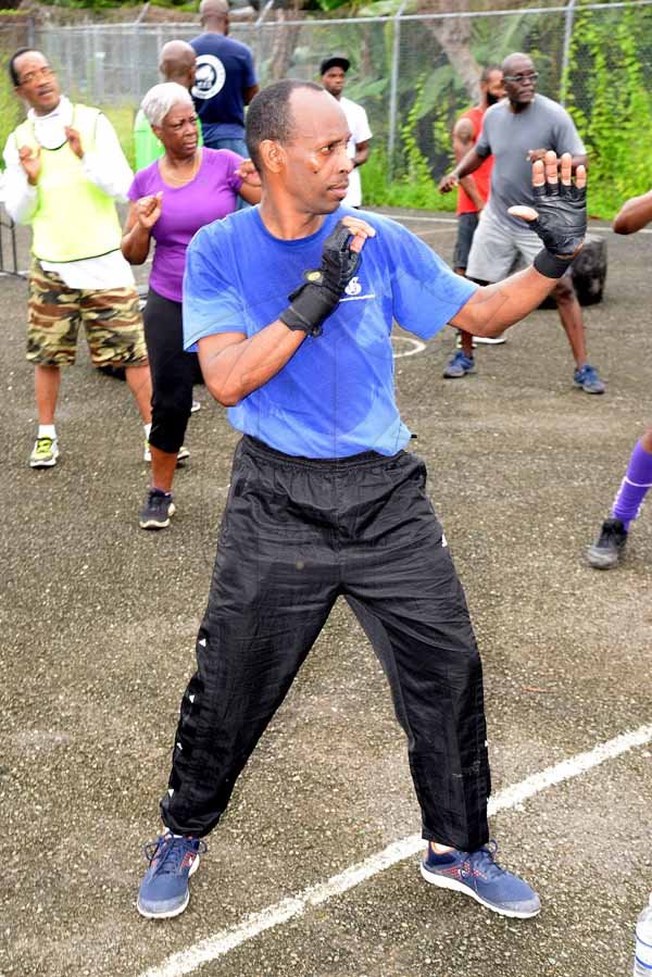 Lionel Rookwood/PhotographerThe Gleaner's Fit 4 Life event with the Trainfit Club's Outdoor Madness, Boxing Fitness with Sakima Mullings and Self Defense with Master Arthur Barrows on Saturday, November 11, at In Motion Gym, Shortwood Teachers' College, St Andrew.