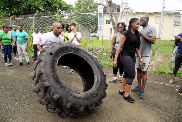 Lionel Rookwood/PhotographerThe Gleaner's Fit 4 Life event with the Trainfit Club's Outdoor Madness, Boxing Fitness with Sakima Mullings and Self Defense with Master Arthur Barrows on Saturday, November 11, at In Motion Gym, Shortwood Teachers' College, St Andrew. *** Local Caption *** Lionel Rookwood/PhotographerRyon Jones gave it all he got in the obstacle boot camp challenge.