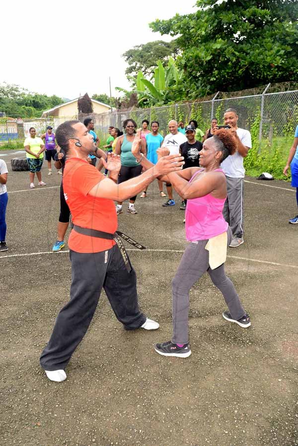 Lionel Rookwood/PhotographerThe Gleaner's Fit 4 Life event with the Trainfit Club's Outdoor Madness, Boxing Fitness with Sakima Mullings and Self Defense with Master Arthur Barrows on Saturday, November 11, at In Motion Gym, Shortwood Teachers' College, St Andrew.