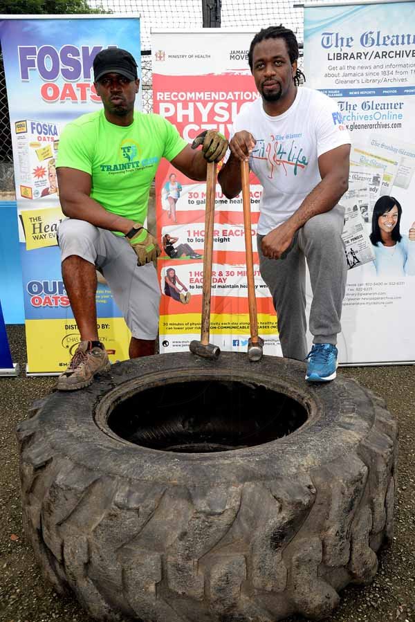 Lionel Rookwood/PhotographerThe Gleaner's Fit 4 Life event with the Trainfit Club's Outdoor Madness, Boxing Fitness with Sakima Mullings and Self Defense with Master Arthur Barrows on Saturday, November 11, at In Motion Gym, Shortwood Teachers' College, St Andrew. *** Local Caption *** Lionel Rookwood/PhotographerTrainFit's Stokely Rose (left) and The Gleaner's Fit 4 Life fitness coach, Marvin Gordon.