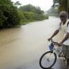 Ricardo Makyn/Staff Photographer.
A cyclist attempts to enter a flooded road in Spanish Town.







walks by the Flooded Road in Spanish Town on Wednesday 29.9.2010.