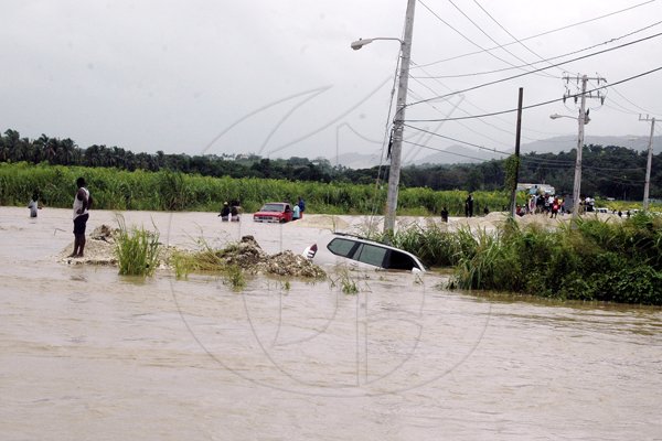 Adrian Frater photo

The driver of this Toyota Prado had to abandon his vehicle after water swept it off the roadway at the intersection of Fairfield Road and Westgreen in Montego Bay, St. James on Wednesday.