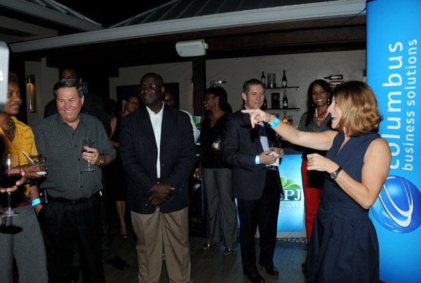 Winston Sill/Freelance Photographer
Flow Jamaica host Cocktail Reception, held at CPU  Market Complex, Lady Musgrave Road on Wednesday night May 1, 2013.