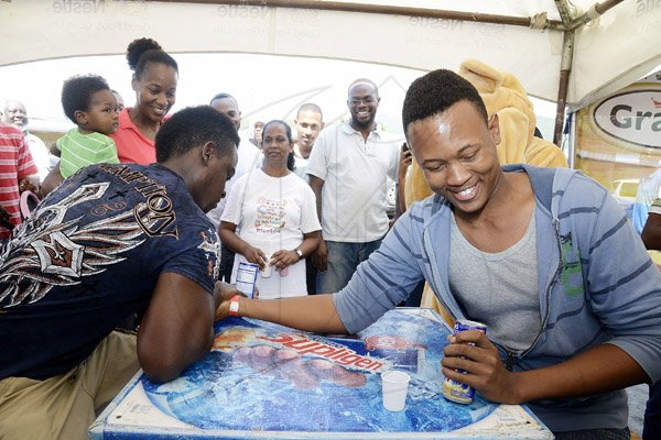 Gladstone Taylor / Photographer

Audel Mantock (left) defeats Oshane Clair in the Supligen arm wrestling competition during the Gleaner's Food Month promotion at Shoppers Fair Supermerket in Harbour View St Andrew yesterday.

____________

as seen at the shoppers fair food month promotion in Harbour View on saturday