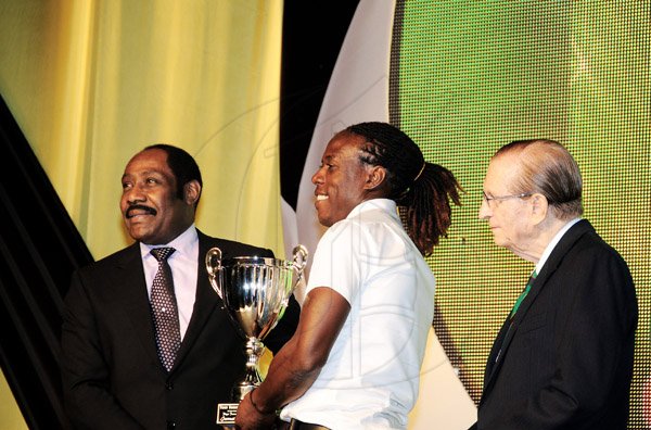 Winston Sill/Freelance Photographer
Waterhouse's Jermaine 'Tuffy' Anderson (centre) receives one of his four awards from Jamaica Football Federation president Captain Horace Burrell (left) at the Red Stripe Premier League Awards Ceremony at the Courtleigh HOtel on Thursday. Looking on is Premier League Clubs Association president Edward Seaga. 



The Jamaica Football Federation (JFF) in association with the Premier League Clubs Association (PLCA) presents the Red Stripe League Awards Ceremony, held at Courtleigh Auditorium, St. Lucia Avenue, New Kingston on Thursday night May 16, 2013.