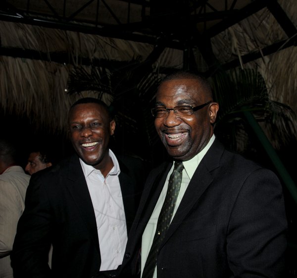 Winston Sill / Freelance Photographer
FosRich Group of Companies Managing Director's Cocktail Reception, held at Hope Zoo Pavilion, Hope Gardens on Wednesday night December 12, 2012. Here are Cecil Foster (left); and Dr. Winston Adams (right).