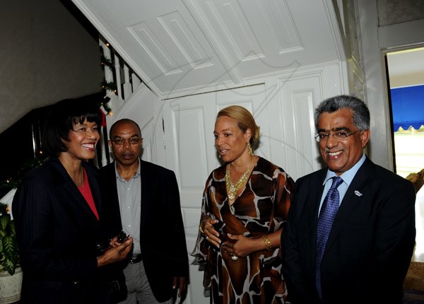 Winston Sill / Freelance Photographer
Portia Simpson-Miller Foundation (PSMF) host Reception in honour of IAAF Council Member Ahmed Al Kamali and Liesa Euton, of the United Arab Emirates Athletics Federation, held at Vale Royal on Sunday December 2, 2012. Here are Prime Minister Portia Simpson-Miller (left); Dr. Warren Blake (second left); Liesa Euton (second right); and Al Kamali (right).