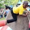 Rudolph Brown/Photographer
This Youngster had a Bull of a time has he was caught in camera riding the Mechanical Bull  At Funfest 2014 a family festival   held at  Hope Garden's  on Sunday, December 21, 2014