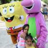 Rudolph Brown/Photographer

Two children enjoy the company of a mascot during  Funfest at Hope Garden, St Andrew, recently on Sunday, December 21, 2014