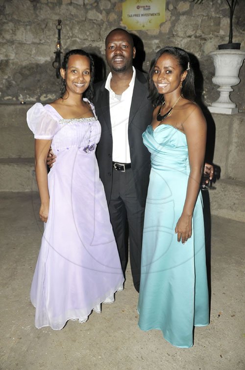 Photo by Christopher Thomas

Fabian Williams, head of business development at Victoria Mutual Wealth Management, is sandwiched by two beautiful Victoria Wealth reps, Tricia-Ann Bicarie (left) and Sanjae Walker.


, during the second annual Georgian Society Costume Ball held at the Bellefield Great House in Montego Bay on Saturday night.