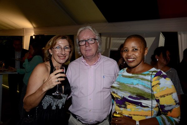 Winston Sill/Freelance Photographer
New German Ambassador Joachim Christoph Schmillen and his wife Maria Toledo De Schmillen host German National Day Reception, held at Bracknell Avenue, Jacks Hill on Friday night October 3, 2014.  Here are Andrea Bickhoff-Benjamin (left); Winfried Schafer (centre); and Mathu Joyini (right), South Africa High Commissioner.