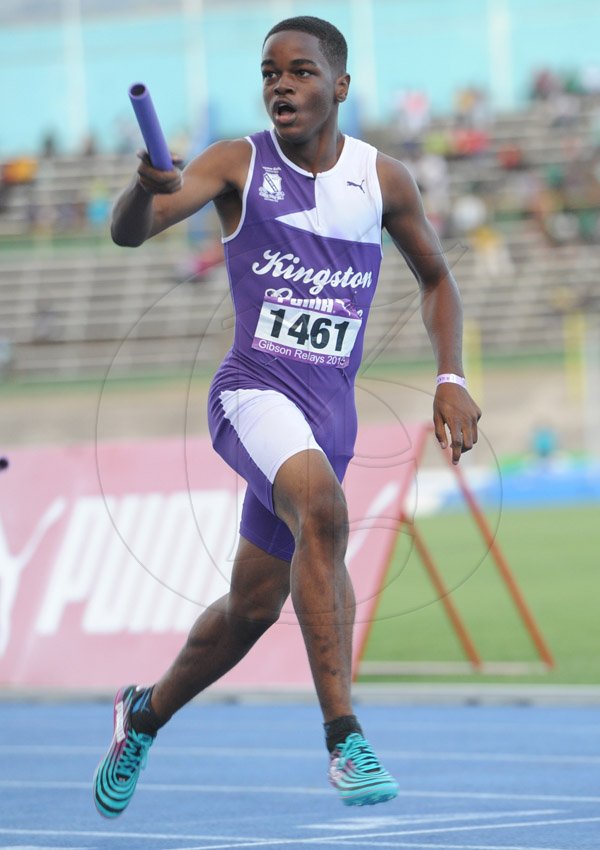 Ricardo Makyn/Staff Photographer 
Kingston College's Tahje-Roje Scott anchors His team to victory in the  Boys Class 3, 4x100 at the 2015 Gibson/McCook relays held at the National Stadium on Saturday 28.2.2015