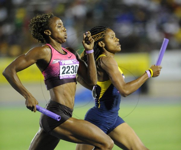 Ricardo Makyn/Staff Photographer 
Sherone  Simpson  competing with Utech's  Semoya Campbell  in the Women's institution 4x400 women's race  at the 2015 Gibson/McCook relays held at the National Stadium on Saturday 28.2.2015