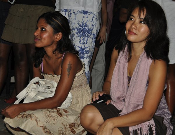 Janet Silvera Photo
?
Sadika Kona (left) and Simone Hew take front row view of the?bass guitarist Taddy Ps 'Gimme di Bass' album launch at Blue Beat, Montego Bay?last Thursday night
