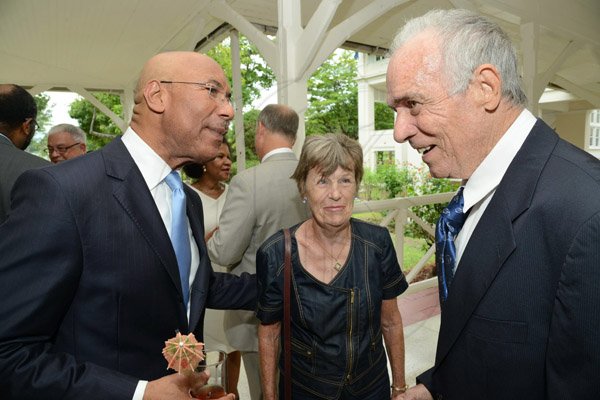 Rudolph Brown/Photographer
Sir Patrick Allen, (left)greets Christopher Roberts and his wife Jill at the Governor General of Jamaica hosted luncheon For Gleaner Directors in honour of the Gleaner 180 Anniversary at Kings House on Sunday, August 31, 2014