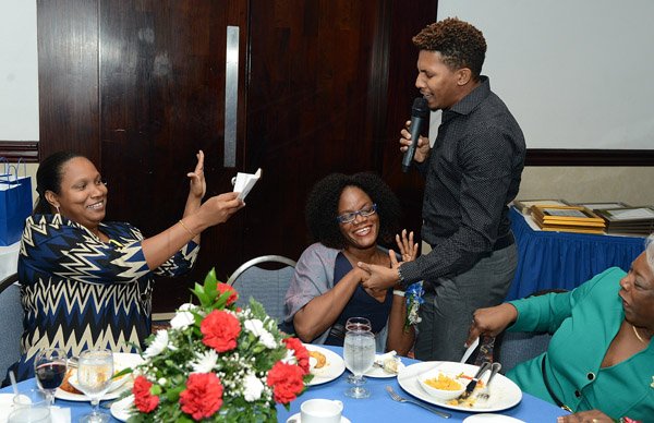 Ian Allen/Photographer
Gleaner Long Service Awards 2016.

Entertainer Mario Evons serenading Sheena Stubbs Gibson during the Gleaner's Long Service Awards Luncheon which was held at the Jamaica Pegasus Hotel.