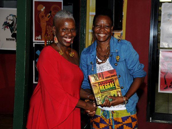 Winston Sill / Freelance Photographer
Launch of book 'Global Reggae' edited by Prof Carolyn Cooper, held at PULS8, Trafalgar Road on Sunday night February 17, 2013. Here Prof. Cooper presents a book to guest speaker Michelle 'DJ Afifa" Harris.