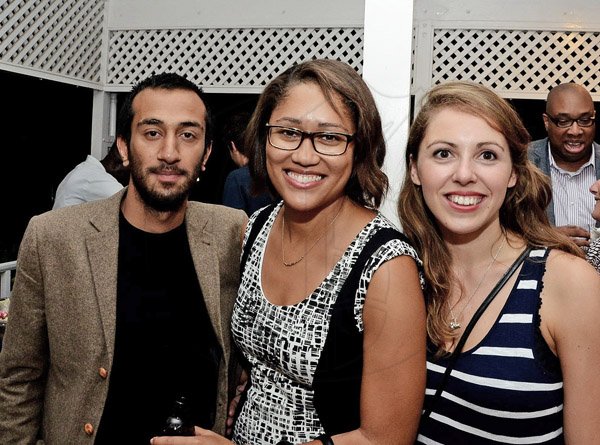 Winston Sill/Freelance Photographer
Cast of Hamlet Naeem Hayat (left) and Phoebe Fildes (right) pose with Red Stripe Brand Manager Erin Mitchell at British High Commissioner David Fitton host reception for Shakespeare Globe  Cast Members who perform the play Hamlet.
