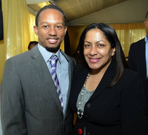 Rudolph Brown/Photographer
Suzette Smellie-Tomlinson, Director, Marketing Programmes, Scotia greets Olympian Michael Frater at the Scotiabank Golden Cleats Awards Luncheon at Venetian Suite, Terra Nova Hotel on Tuesday, January 8, 2013.