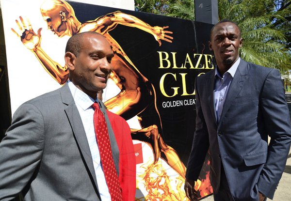 Rudolph Brown/Photographer
Lissant Mitchell, (right) CEO Scotia Investments pose with Olympian Usain Bolt, Male athlete of the year at the Scotiabank Golden Cleats Awards Luncheon at Venetian Suite, Terra Nova Hotel on Tuesday, January 8, 2013.
