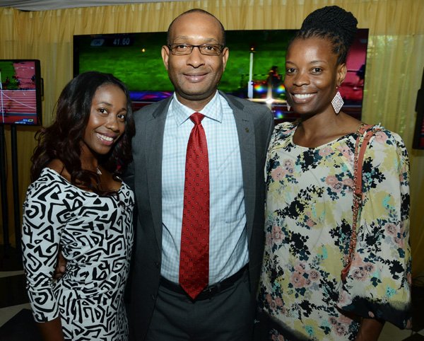 Rudolph Brown/Photographer
Lissant Mitchell, CEO Scotia Investments pose with Female athlete of the year Shelly-Ann Fraser Pryce, (lef) and Olympian Juliet Campbell at the Scotiabank Golden Cleats Awards Luncheon at Venetian Suite, Terra Nova Hotel on Tuesday, January 8, 2013.