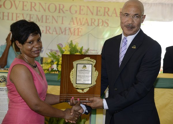 Gladstone Taylor / Photographer
 
Christine Natalie Downer, JP (Award Recipient for the Parish of Portland) accepts her award from Sir Patrick Allen (Governer General) as seen at the Governer General's Achievement Awards held at the Whispering Bamboo Cove Resort, Morant Bay, St. Thomas