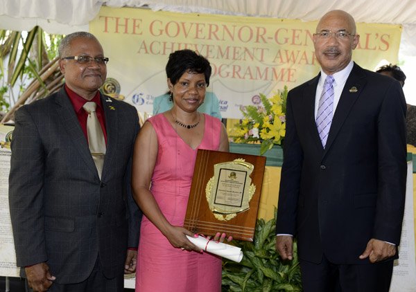 Gladstone Taylor / Photographer
 
l-r Hon. Lincoln Thaxter, JP (Custos of Portland) ,Christine Natalie Downer, JP (Award Recipient for the Parish of Portland) and Sir Patrick Allen (Governer General) as seen at the Governer General's Achievement Awards held at the Whispering Bamboo Cove Resort, Morant Bay, St. Thomas