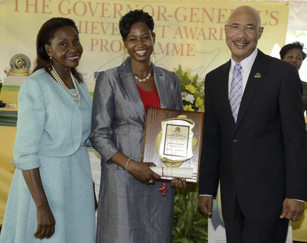 MINOTT

Gladstone Taylor / Photographer
 
l-r Hon Marcia Bennet, CD, JP (Custos of St. Thomas), Donna-Lee Cora Minott (Award Recipient for the Parish of St. Thomas) and Sir Patrick Allen (Governer General) as seen at the Governer General's Achievement Awards held at the Whispering Bamboo Cove Resort, Morant Bay, St. Thomas