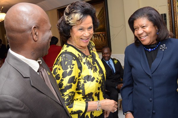 Rudolph Brown/Photographer
Chief Justice, Hon.  Zaila McCalla (right) chat with Custos of Kingston, Hon. Steadman Fuller and Custos of St. Andrew, Hon. Marigold Harding at the Governor General’s Achievement Award for the County of Surrey presentation Ceremony for recipients on Thursday, September 25, 2014