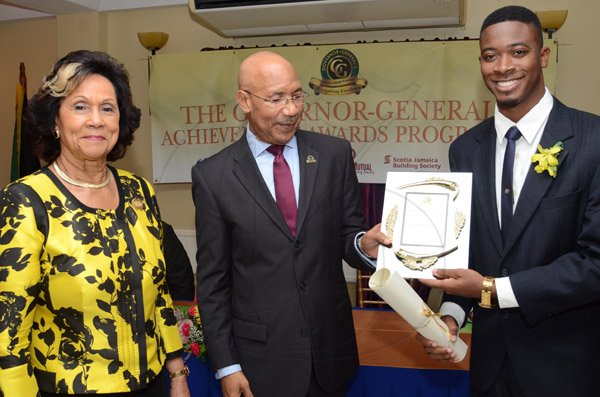 Rudolph Brown/Photographer
GG presents awward to Joel Nomdarkham while Custos of St. Andrew, Hon. Marigold Harding looks on at the Governor General’s Achievement Award for the County of Surrey presentation Ceremony for recipients on Thursday, September 25, 2014