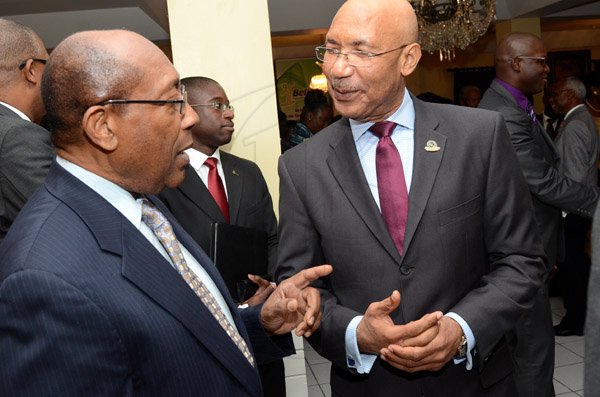 Rudolph Brown/Photographer
Dr. Henry Lowe, (left) chat with Sir Patrick Allen, Governor General of Jamaica Governor-General’s Achievement Award for the County of Surrey presentation Ceremony for recipients on Thursday, September 25, 2014