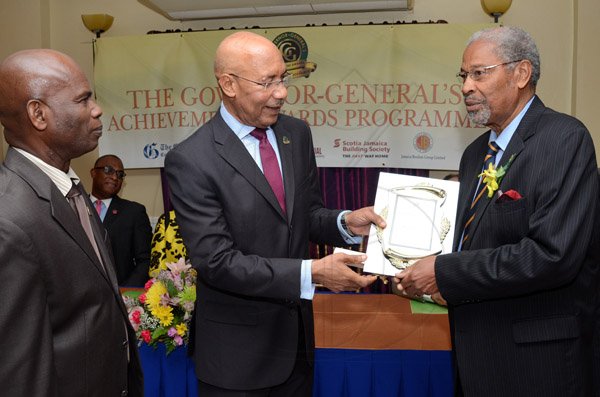 Rudolph Brown/Photographer
GG presents award to Alfred Grant while Custos of Kingston, Hon. Steadman Fuller looks on at the Governor General’s Achievement Award for the County of Surrey presentation Ceremony for recipients on Thursday, September 25, 2014