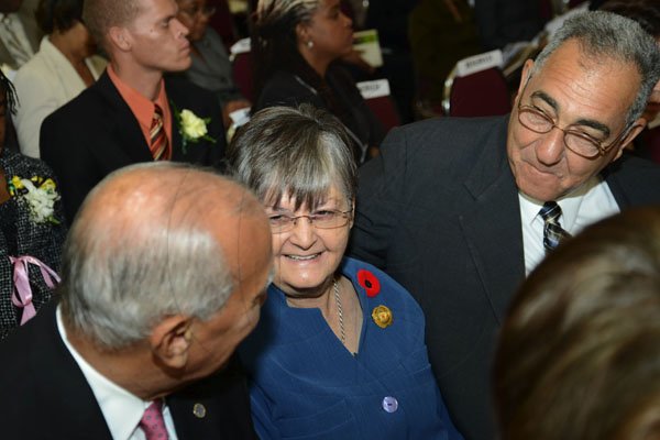 Rudolph Brown/Photographer
Dennis Lalor (left) chats with Custos of Manchester Sally Porteous and Custos of Clarendon William Shagoury at the Governor General's Achievement Awards at Kings House on Tuesday, November 13, 2012
