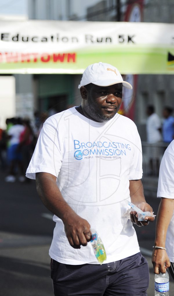 Ricardo Makyn/Staff Photographer
Cordel Green of the Broadcasting Commission  at the Grace Kennedy Education Run 5K on Sunday 8.7.2012
