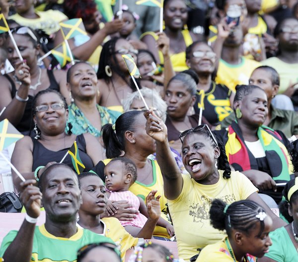 Ricardo Makyn/Staff Photographer
This woman waves her flag enthusiastically at the Grand Gala to mark Jamaica's 49th Year of Independence at the National Stadium on Independence Day August  6.