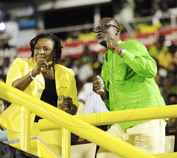 Ricardo Makyn/Staff Photographer
                                                                                The Hon. Olivia Grange (left) and Desmond McKenzie, enjoying the Grand Gala together.                                                                                                                                                                                                    to mark Jamaica's 49th Year of Independence at the National Stadium on Independence Day Saturday 6.8.2011