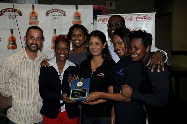Winston Sill / Freelance Photographer
Appleton Estate All-Jamaica Grill Off 2012 Prizegiving Ceremony, held at Fiction Night Club, Market Place on Thursday night March 7, 2013. Here are members of the Gleaner Taem with promoter of the All-Jamaica Grill Off Craig Powell (left).