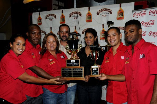 Winston Sill / Freelance Photographer
Appleton Estate All-Jamaica Grill Off 2012 Prizegiving Ceremony, held at Fiction Night Club, Market Place on Thursday night March 7, 2013. Here Anna Chin (third left) and members of Jo Jo's Jerk Pit team accepts the Reserve Grand Champion Trophy from Craig Powell (fourth left), Promoter,  All-Jamaica Grill Off; and Kerry Bell (third right).