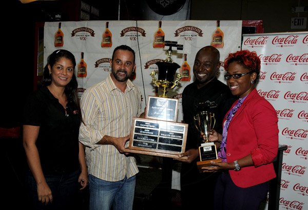 Winston Sill / Freelance Photographer
Appleton Estate All-Jamaica Grill Off 2012 Prizegiving Ceremony, held at Fiction Night Club, Market Place on Thursday night March 7, 2013. Here are Kerry Bell (left); Craig Powell (second left), Promoter of All-Jamaica Grill Off; Garth Walker (second right); and Simone Riley (right), both of Wealth Grillers the Grand Champion winners.