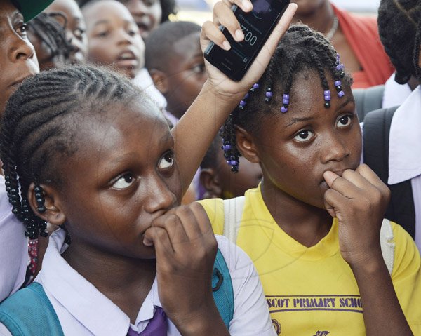 Jermaine Barnaby/Photographer
Lydia Lewis (left) and Malica Green as they await the announcement of their GSAT results at the Ascot Primary School in Portmore on Wednesday June 17, 2015.