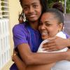 Jermaine Barnaby/Photographer
Grade 6 supervising teacher, Andrea Calder-Alexander (right) gives a congratulary hug to Lauren Barrette on receiving perfect scores in her Gsat results at the Sts Peter and Paul Prep school in Kingston on Thursday June 18, 2015.