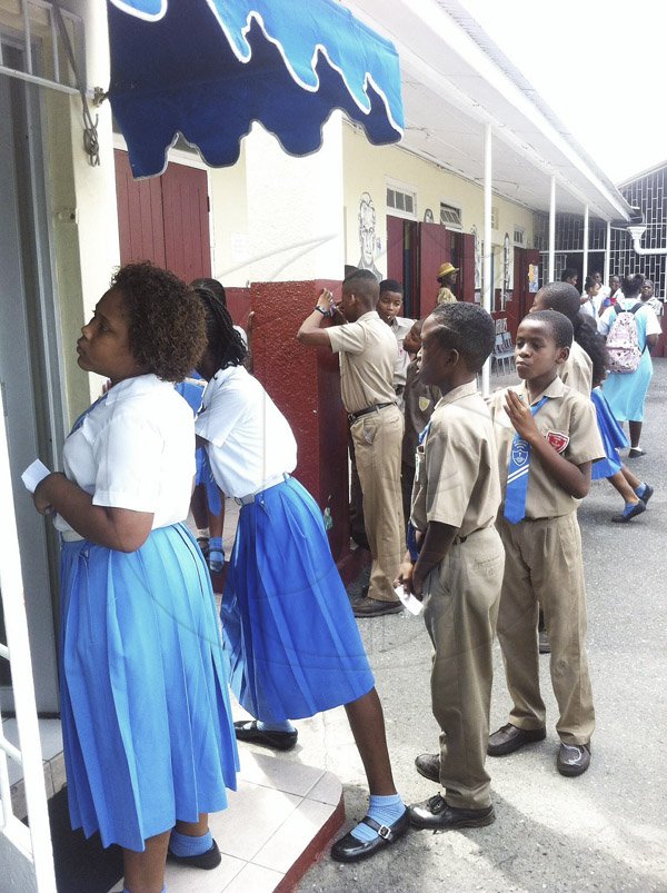Ruddy Mathison photo <\n><\n>Students waiting eagerly outside the principal's office at<\!p>St Catherine Preparatory School to find out their individual results in the Grade Six Achievement Test. <\n><\n>