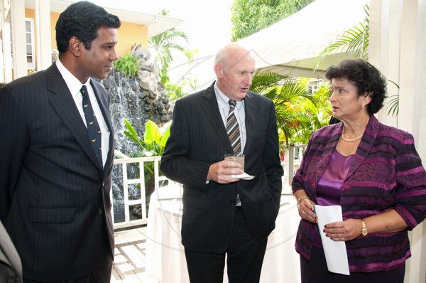 Gladstone Taylor / Photographer

Guardsman Group Managing Director Valerie Juggan-Brown listens keenly to ACP Les Green (centre) while Gerald Wight, CEO of Guardsman Limited looks on.


Luncheon