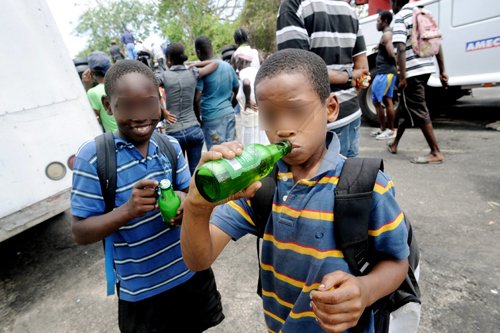 Ricardo Makyn/Staff Photographer.
Even little boys, who were obviously not supposed to be drinking alcohol, were seen sipping from bottles that were looted.