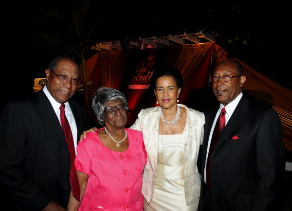 Winston Sill / Freelance Photographer
Launch of Dr. Henry Lowe Autobiography titled "It Can Be Done", held at Eden Gardens, Lady Musgrave Road on Wednesday night November 28, 2012. Here are Dr. Herbert Lowe (left), brother; Josephine Lowe (second left), mother; Janet Lowe (second right), Henry's wife; and Dr. Henry Lowe (right).