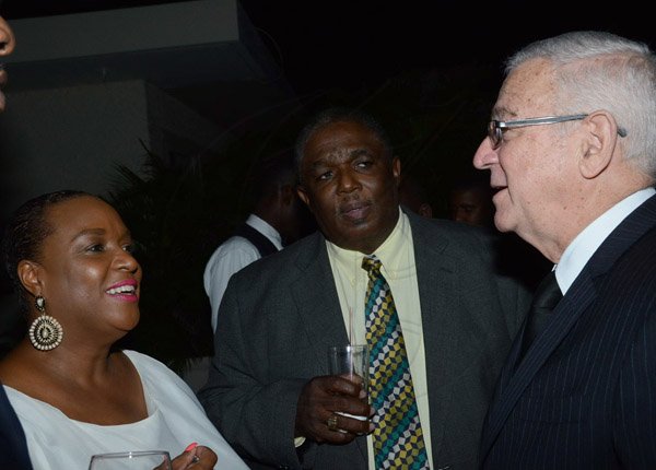 Winston Sill/Freelance Photographer
Audrey Hinchcliffe celebrates her 75th Birthday with family and friends, held at Terra Nova All-Suite Hotel, Waterloo Road on Saturday night January 10, 2015. Here rae Jacqueline Coke-Lloyd (left); Evon Lloyd (centre); and Minister Ronald Thwaites (right).
